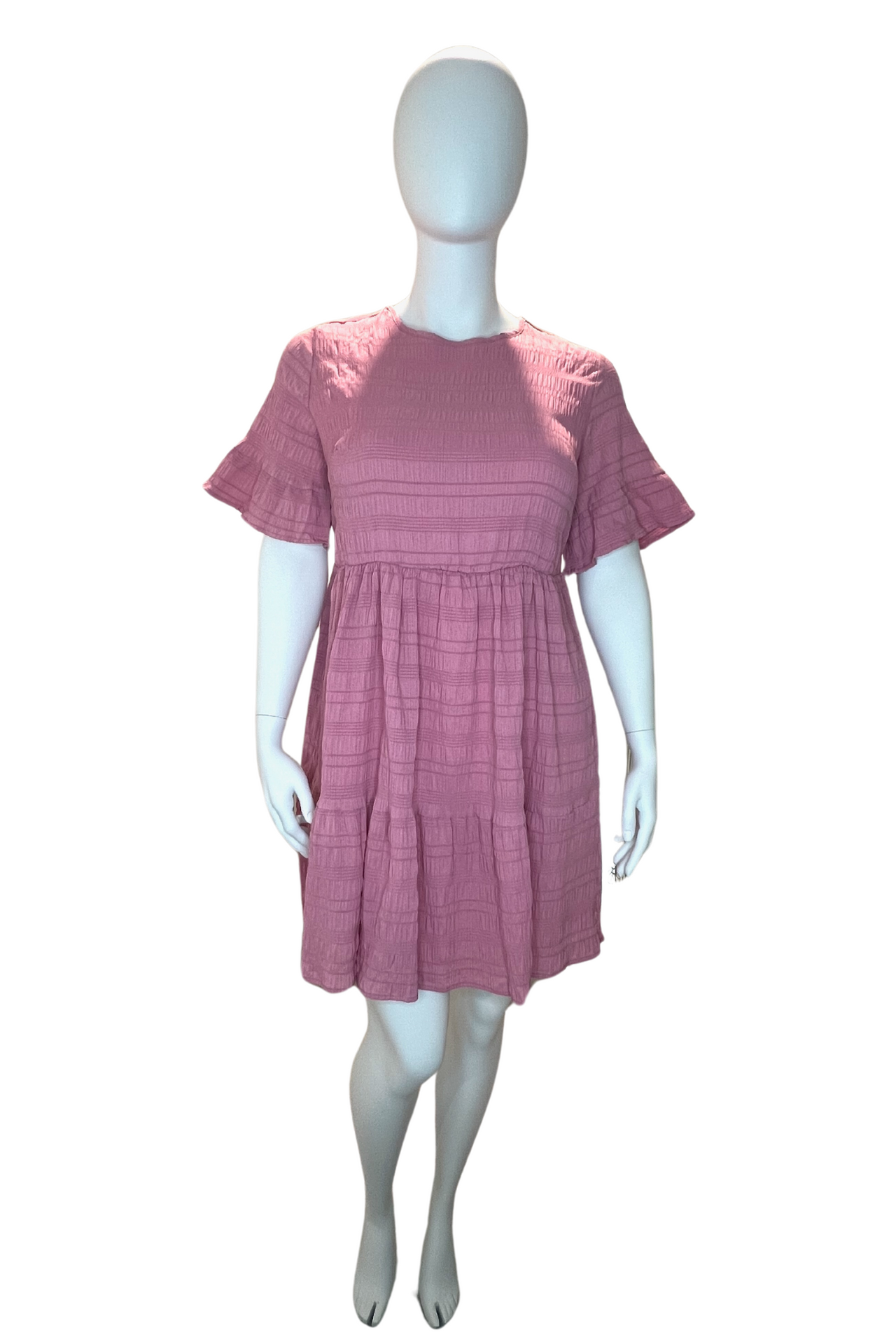 Shop our Plus Size Textured Ruffle Hem Dress – casual fit & flare crew neck with ruffle sleeves, perfect for spring & summer style. 100% polyester."